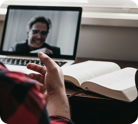 Person on a video call at home with a laptop